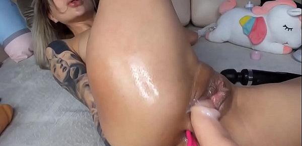  Tattoed girl enjoys fucking herself with big Dildo